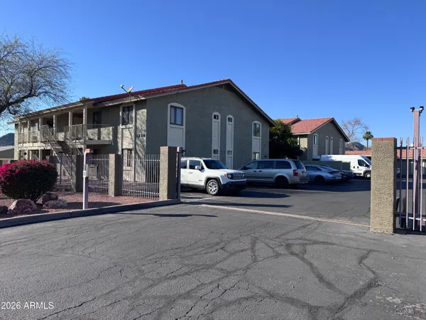 a view of a car park in front of house