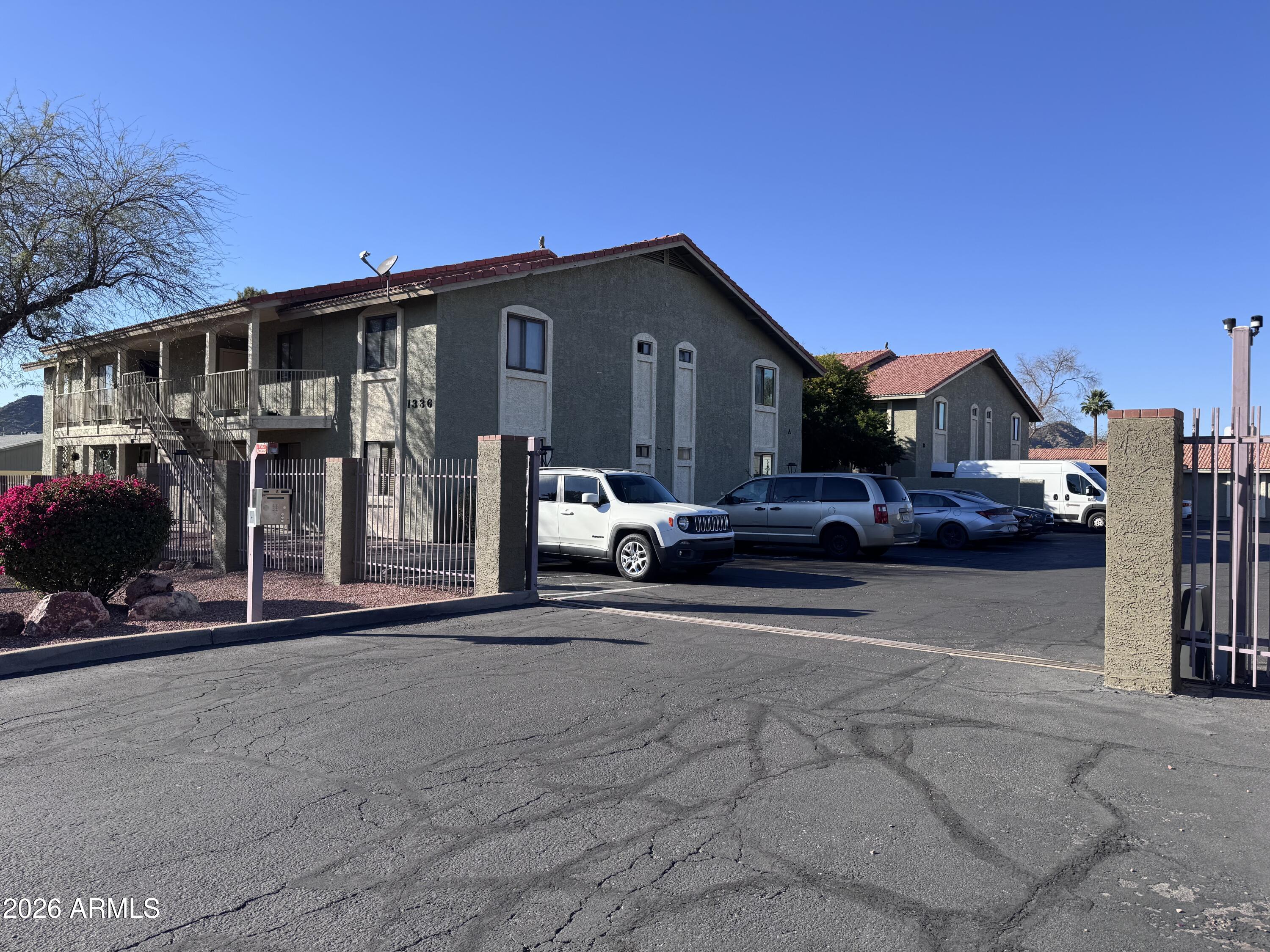 1336 East Mountain View Road, Unit 201 Phoenix, AZ 85020 - Photo 3 of 16 a view of a car park in front of house