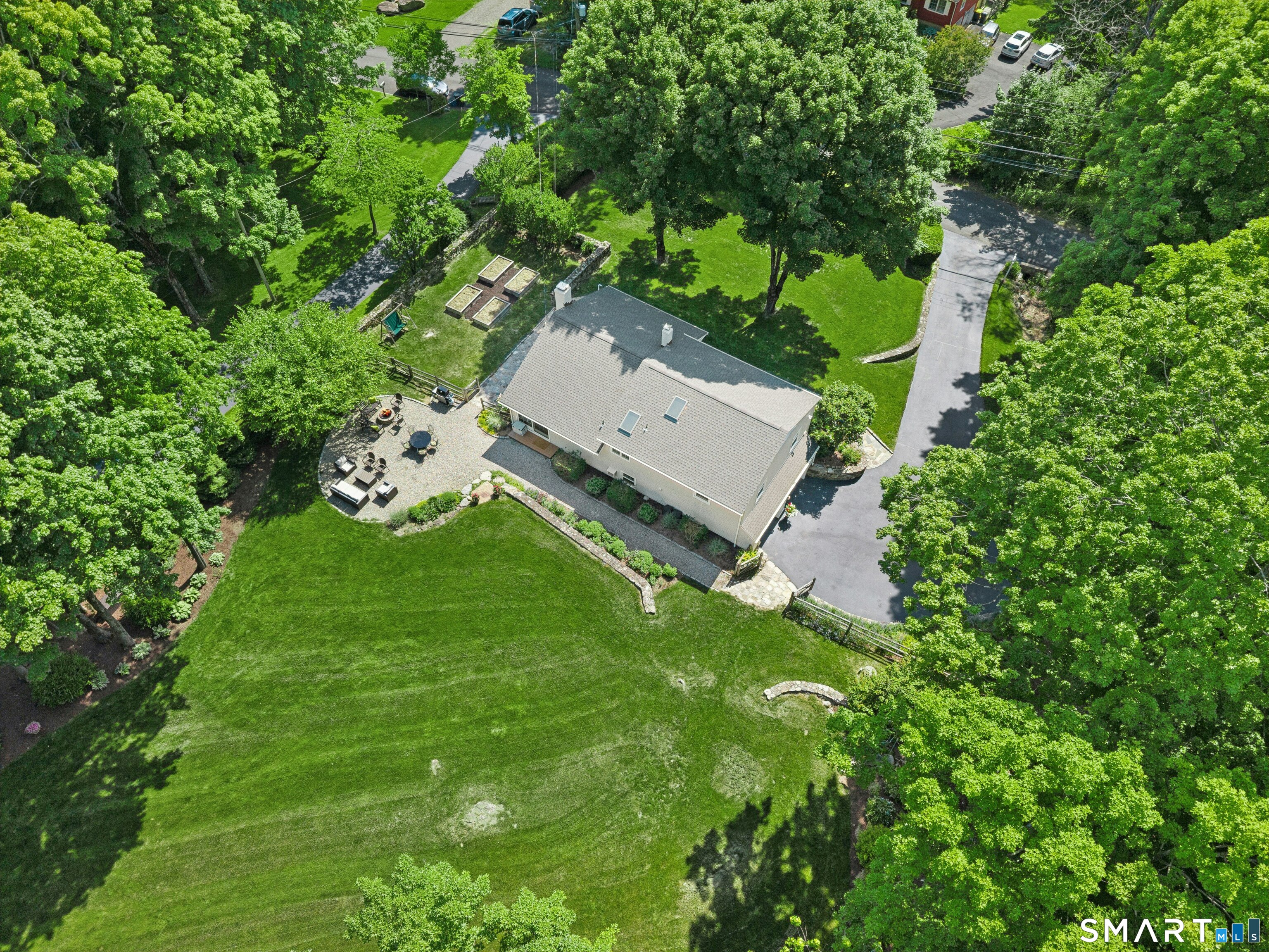 29 Old Farm Road Weston, CT 06883 - Photo 5 of 10 Despite its peaceful surroundings, the location offers convenience to shops, restaurants, and trains, including Wire Mill Barbecue just a short stroll away.