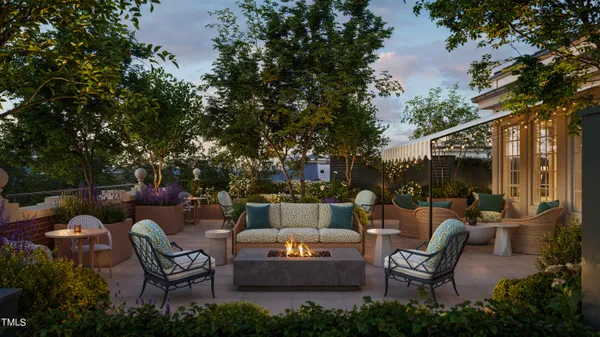 a backyard of a house with outdoor seating