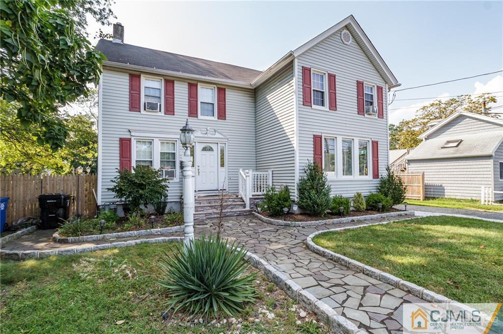 294 E Road Middletown, NJ 07718 - Photo 1 of 23 a front view of a house with a yard