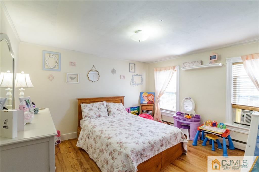 294 E Road Middletown, NJ 07718 - Photo 16 of 23 a bed room with a bed and a window