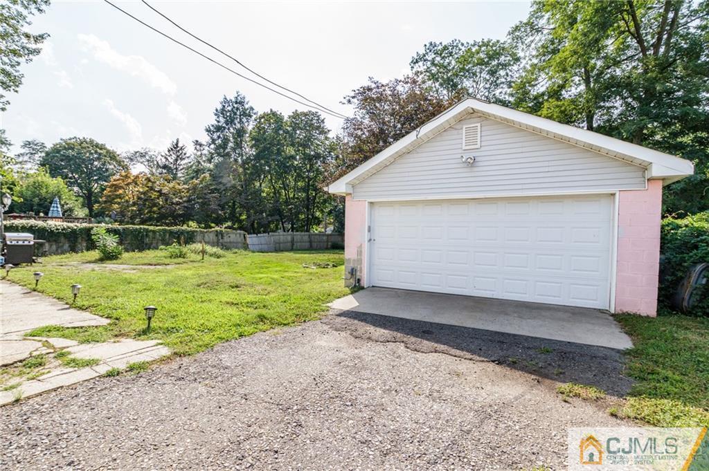 294 E Road Middletown, NJ 07718 - Photo 21 of 23 a front view of house with yard and green space