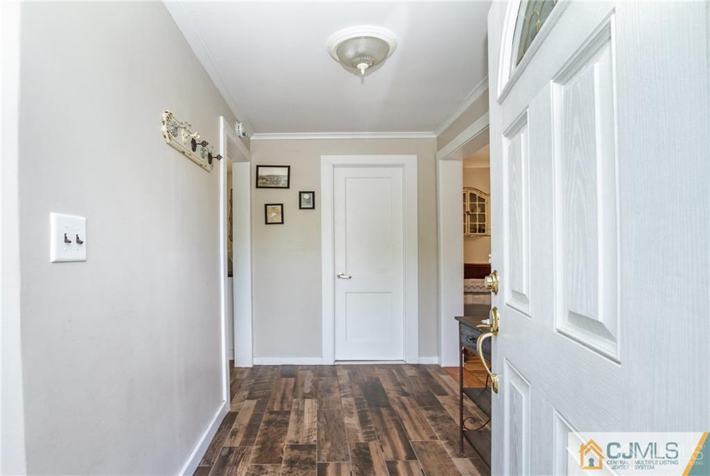 294 E Road Middletown, NJ 07718 - Photo 3 of 23 a view of a bedroom with wooden floor and closet