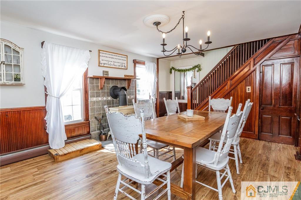294 E Road Middletown, NJ 07718 - Photo 4 of 23 a view of a dining room with furniture and wooden floor