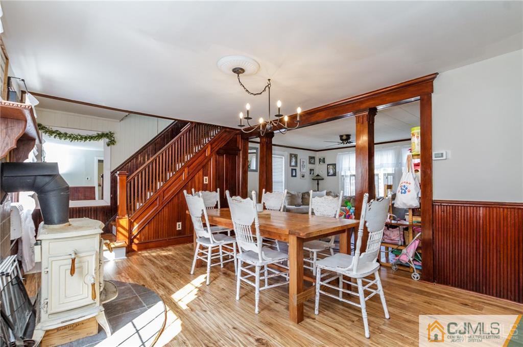 294 E Road Middletown, NJ 07718 - Photo 5 of 23 a view of a dining room with furniture wooden floor and chandelier