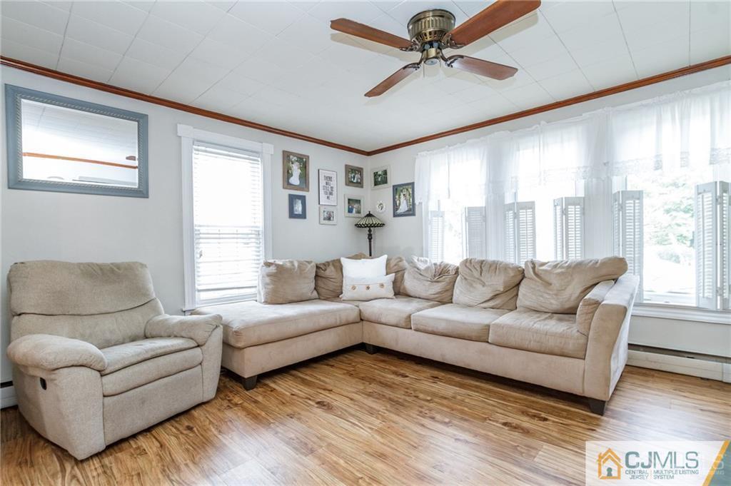 294 E Road Middletown, NJ 07718 - Photo 8 of 23 a living room with furniture and a large window