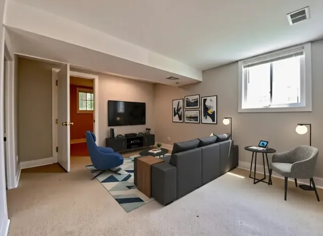 a living room with furniture and a flat screen tv