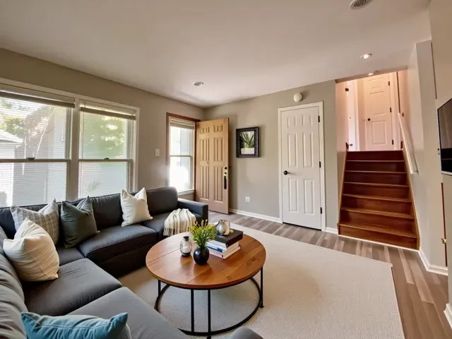 a living room with furniture and a large window