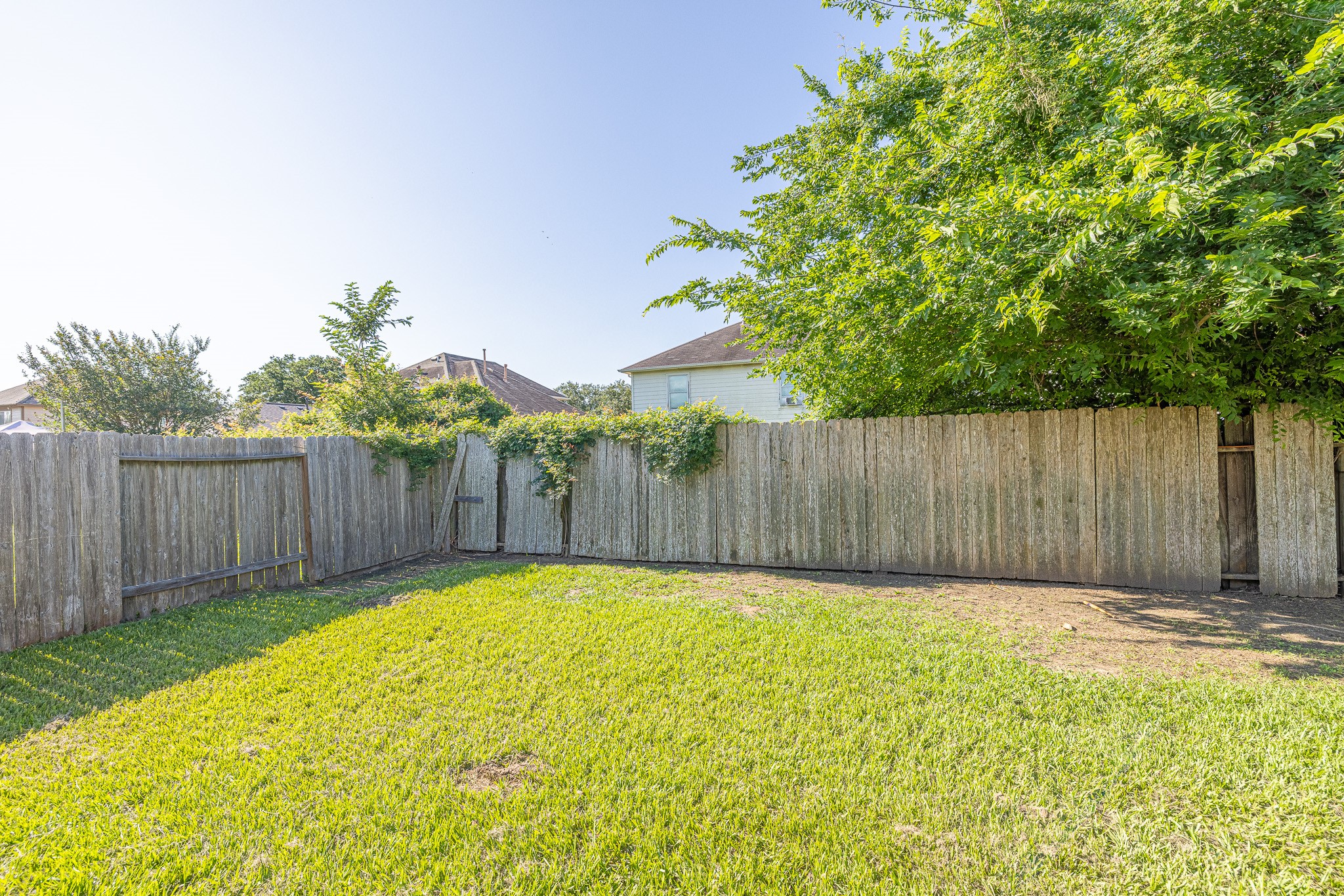 3818 Hunters Trail Baytown, TX 77521 - Photo 32 of 32 a view of a backyard with a small cabin