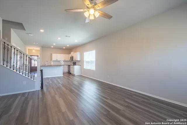 a view of a kitchen with a sink and a window