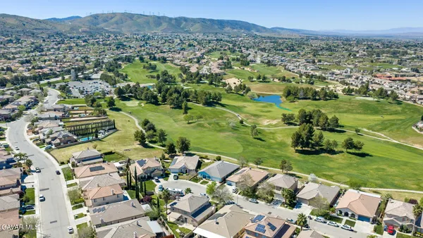 a view of a city with mountains in the background