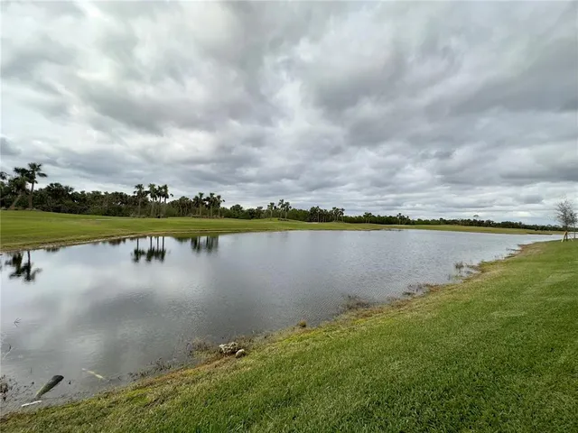 a view of a lake with a big yard
