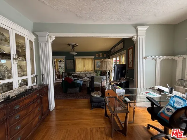 a view of a livingroom with furniture and a large window