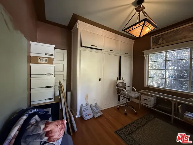 a room with gym equipment and a window