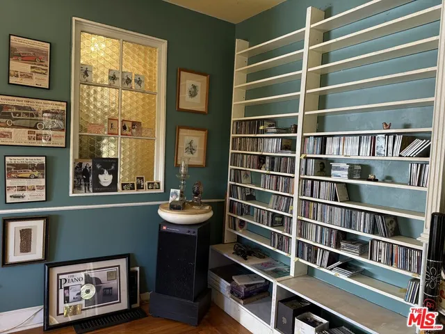 a view of a livingroom with furniture and a window