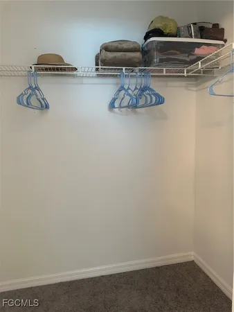 a kitchen with a refrigerator and cabinets