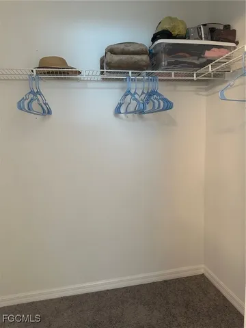 a kitchen with a refrigerator and cabinets