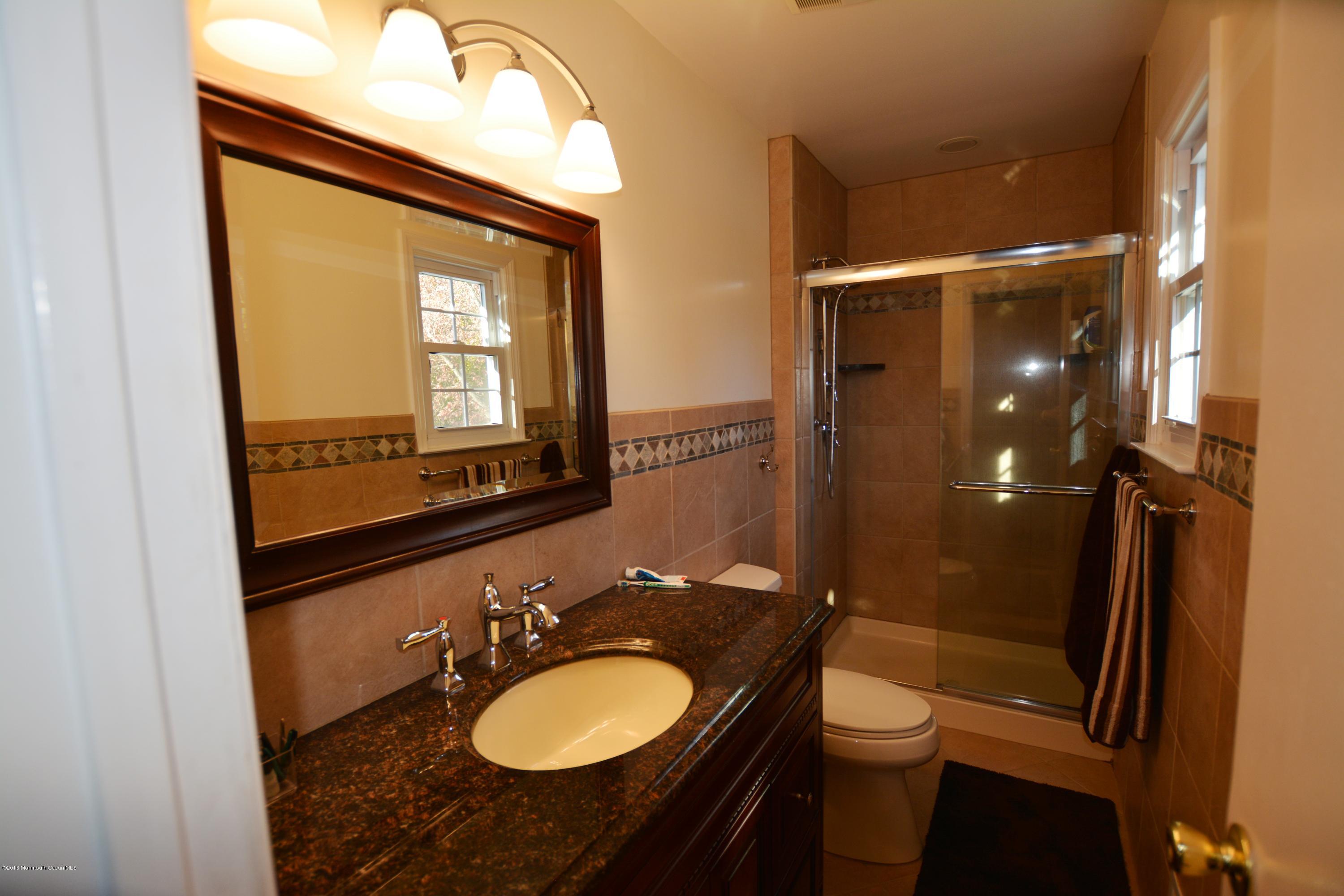 2 Appletree Road Howell, NJ 07731 - Photo 11 of 19 a bathroom with a sink vanity mirror and toilet