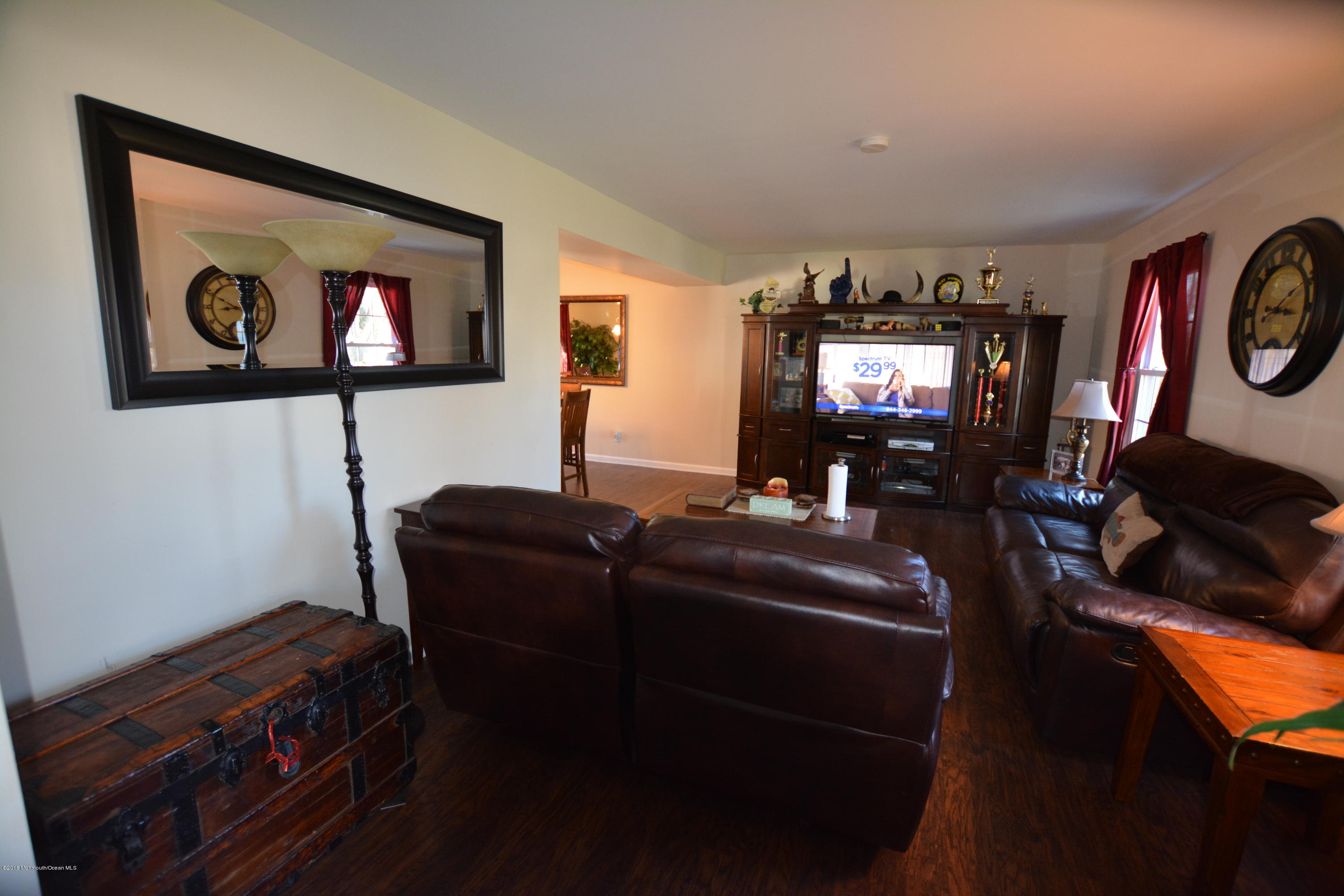 2 Appletree Road Howell, NJ 07731 - Photo 3 of 19 a living room with furniture and a flat screen tv