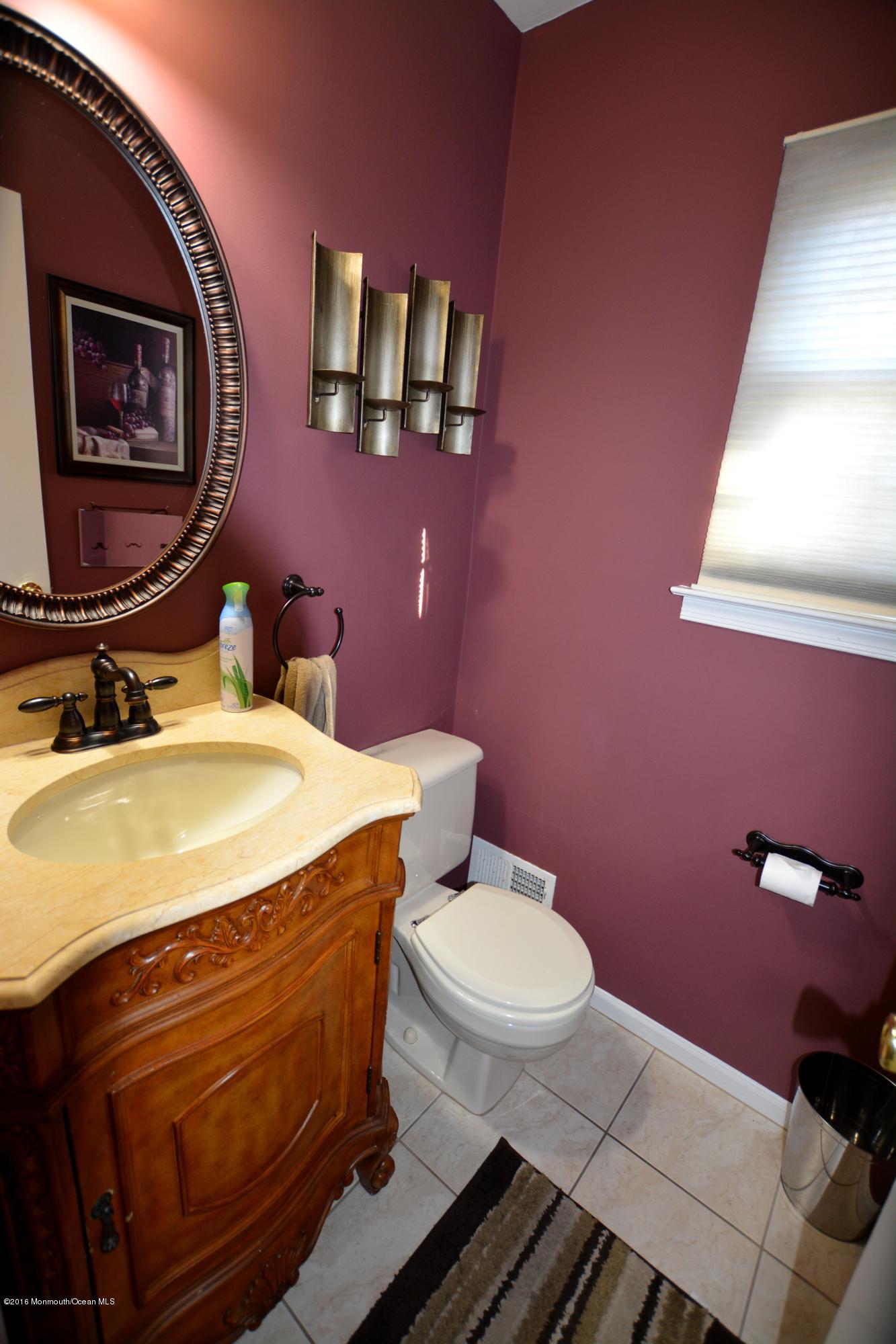 2 Appletree Road Howell, NJ 07731 - Photo 5 of 19 a bathroom with a sink mirror and toilet