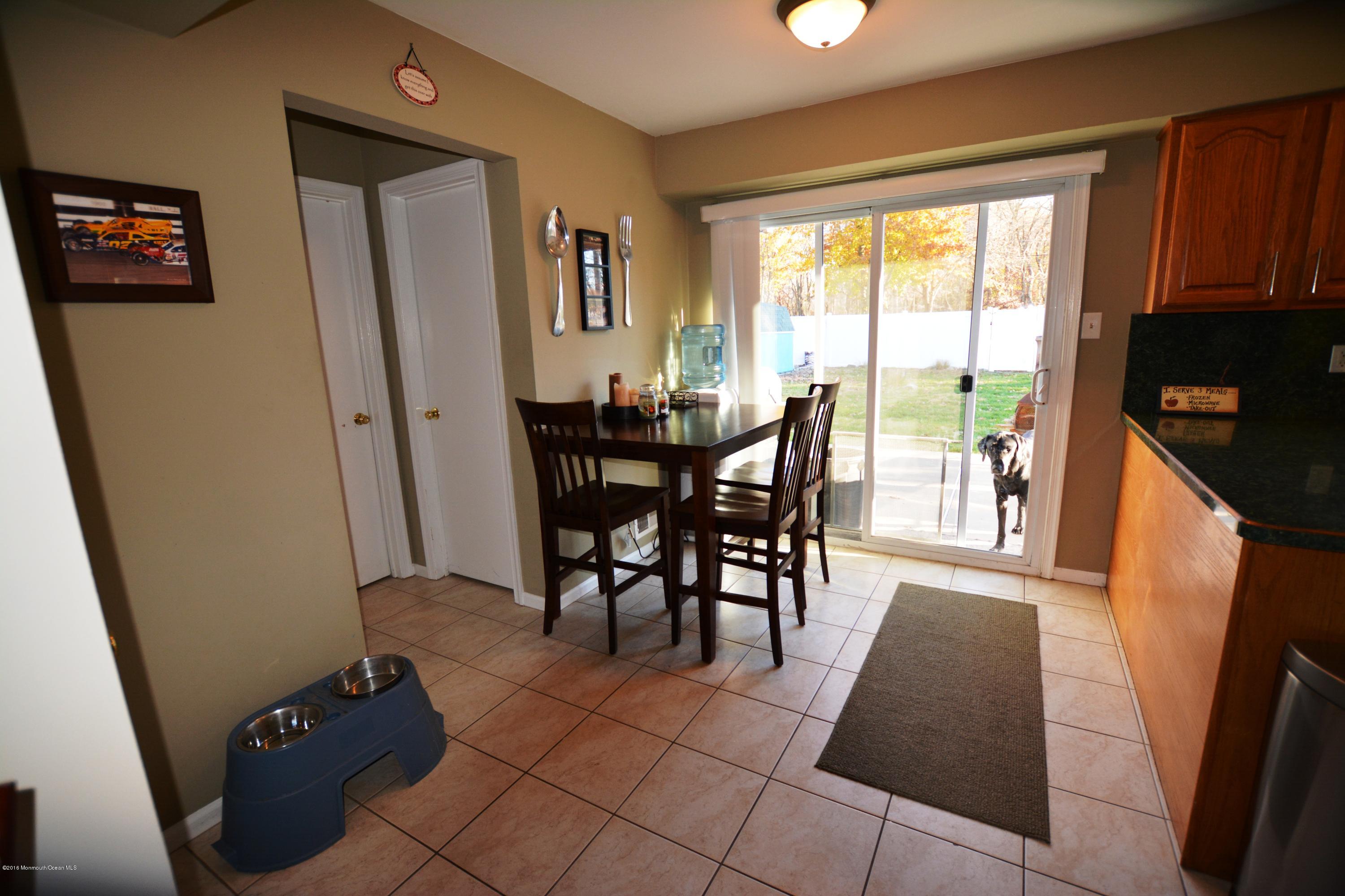 2 Appletree Road Howell, NJ 07731 - Photo 8 of 19 a view of a dining room with furniture and a window