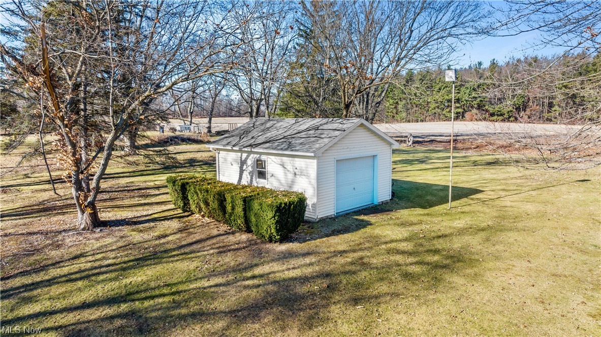 22814 Buck Road Alliance, OH 44601 - Photo 14 of 17 View of outdoor structure with a garage and a yard