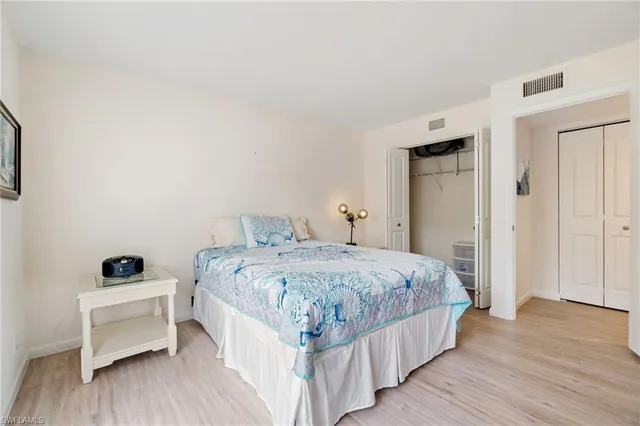 a bedroom with a bed and a view of bathroom