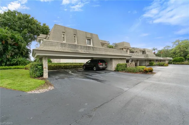 a view of a street with a car parked in front of it