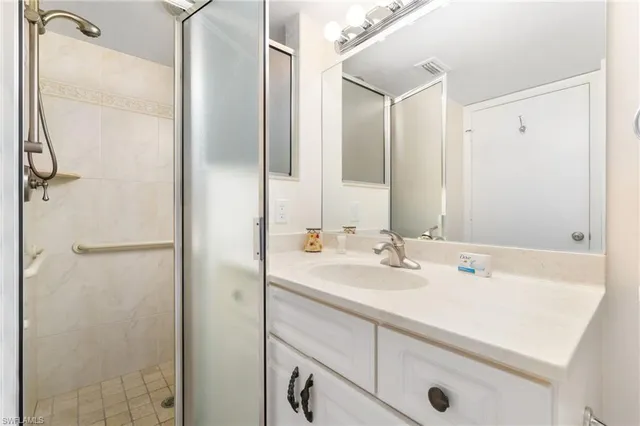 a bathroom with a sink and mirror