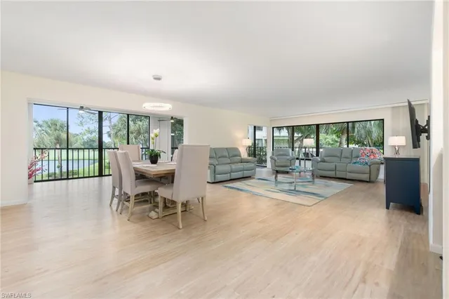 a view of a dining room with furniture wooden floor and a rug