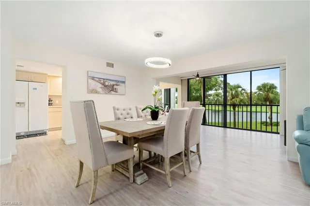 a view of a dining room with furniture wooden floor and a rug