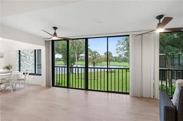 a view of a room with a large window