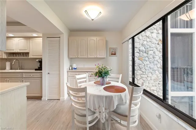 a kitchen with a table and chairs