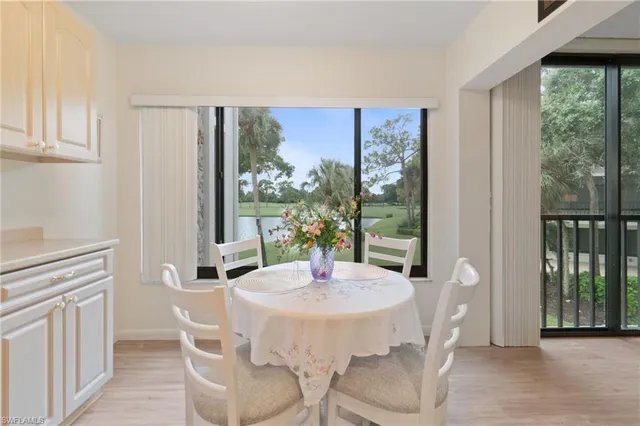 a dining room with furniture and window