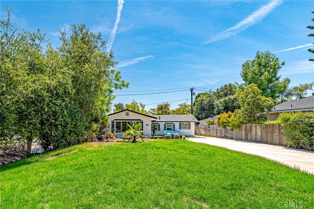 1280 East Woodbury Road Pasadena, CA 91104 - Photo 5 of 40 a view of a house with a yard