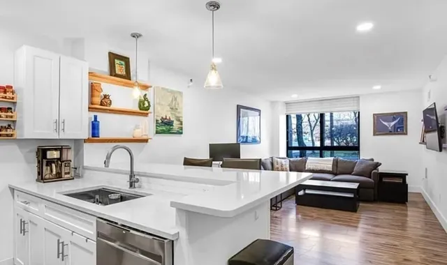 a kitchen with a stove a sink and a refrigerator