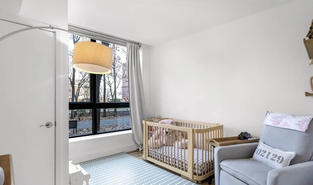 42 8th Street, Unit 3103 Boston, MA 02129 - Photo 8 of 11 a bedroom with a bed and a window