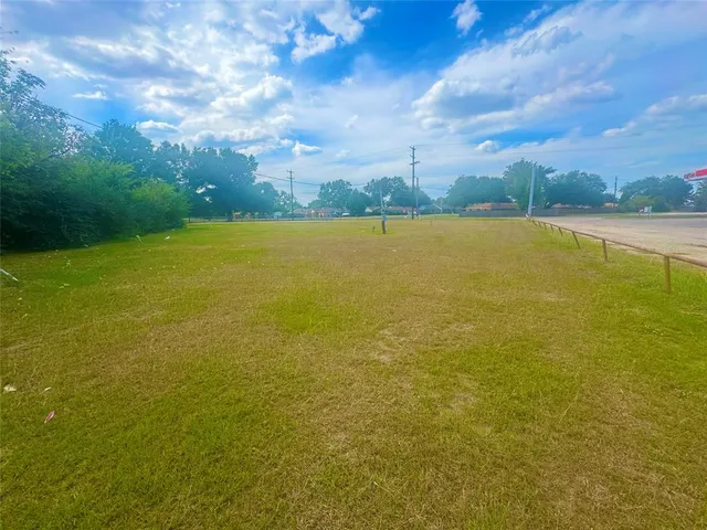 a view of a swimming pool with an outdoor seating and yard