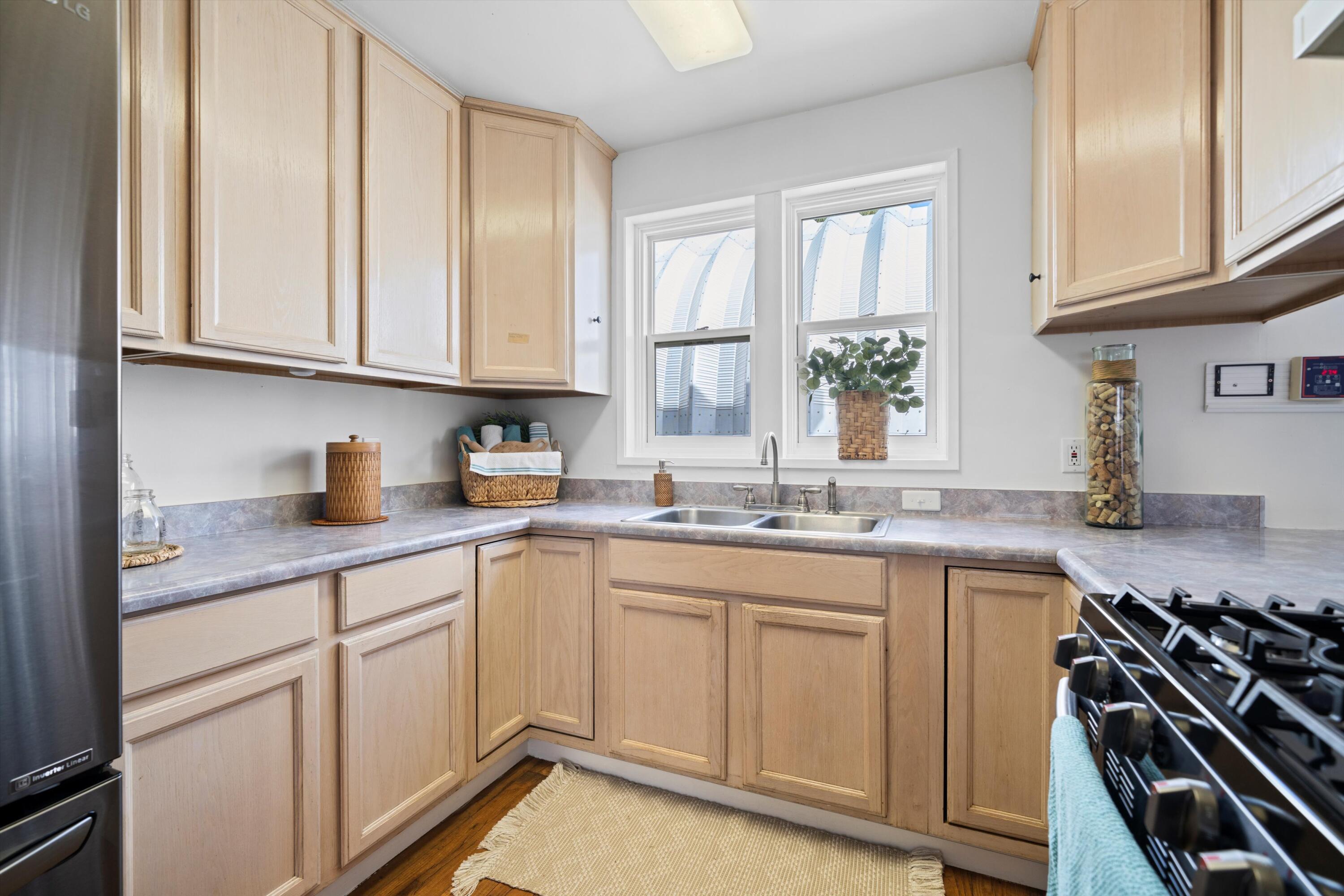 16930 Grindelwald Drive Tehachapi, CA 93561 - Photo 12 of 45 a kitchen with a sink stove and cabinets