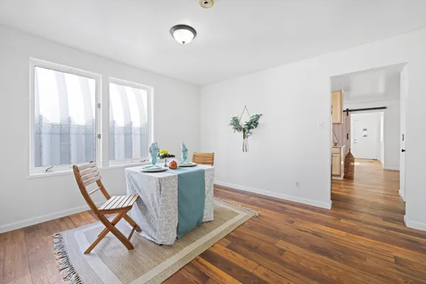 a workspace with furniture and wooden floor