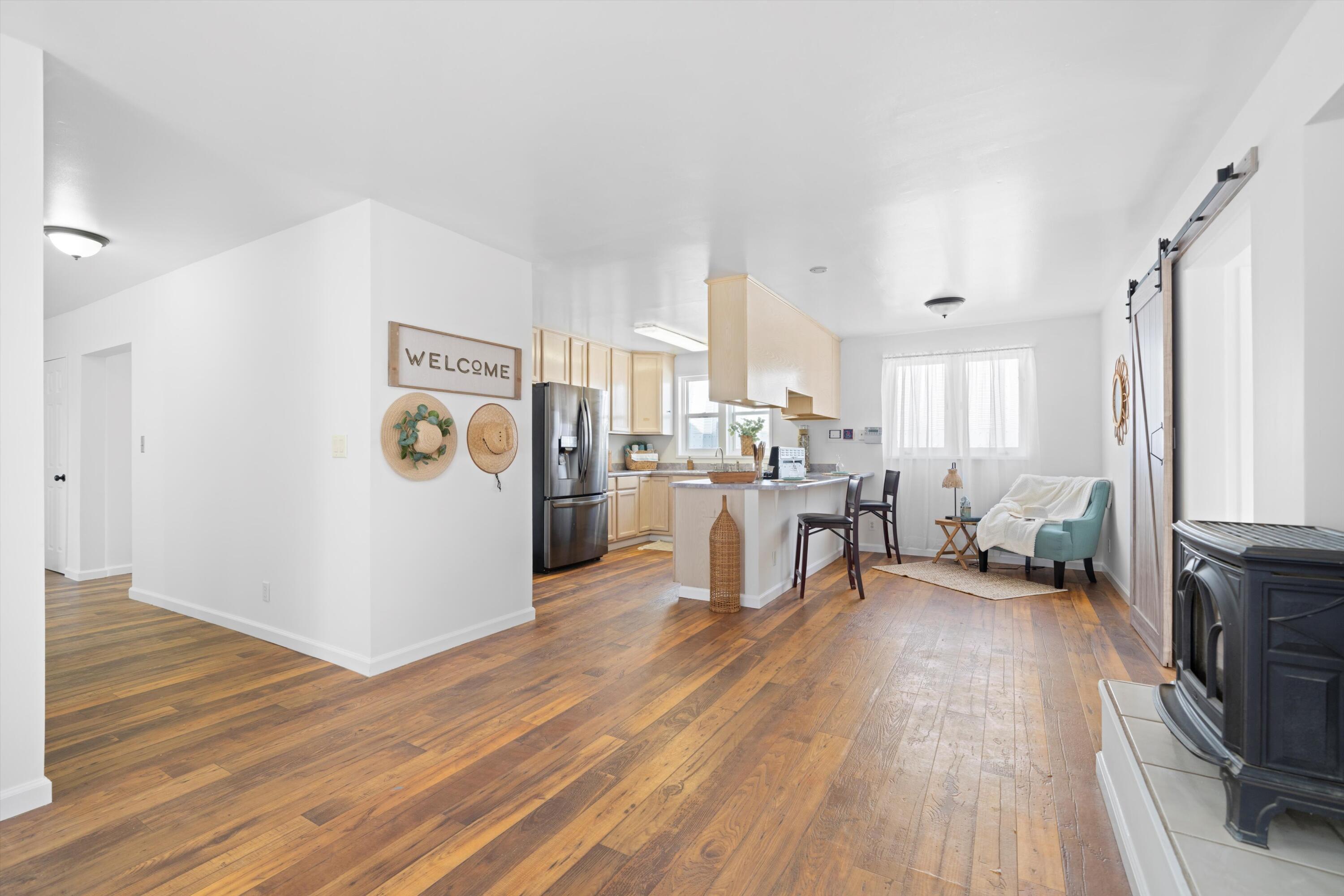 16930 Grindelwald Drive Tehachapi, CA 93561 - Photo 9 of 45 a view of a kitchen with furniture and wooden floor