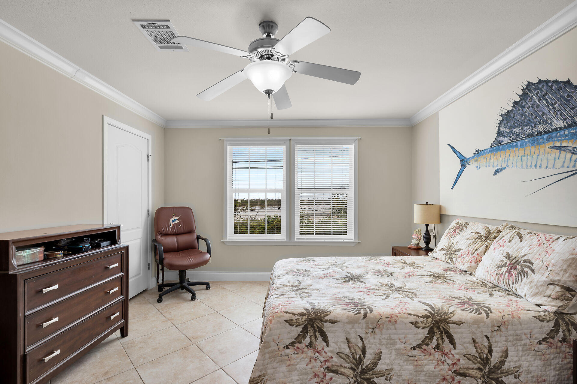 437 Pirates Road Summerland Key, FL 33042 - Photo 23 of 39 a bedroom with a bed dresser and a window