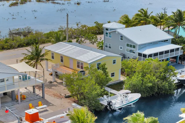 an aerial view of a house with a garden and plants