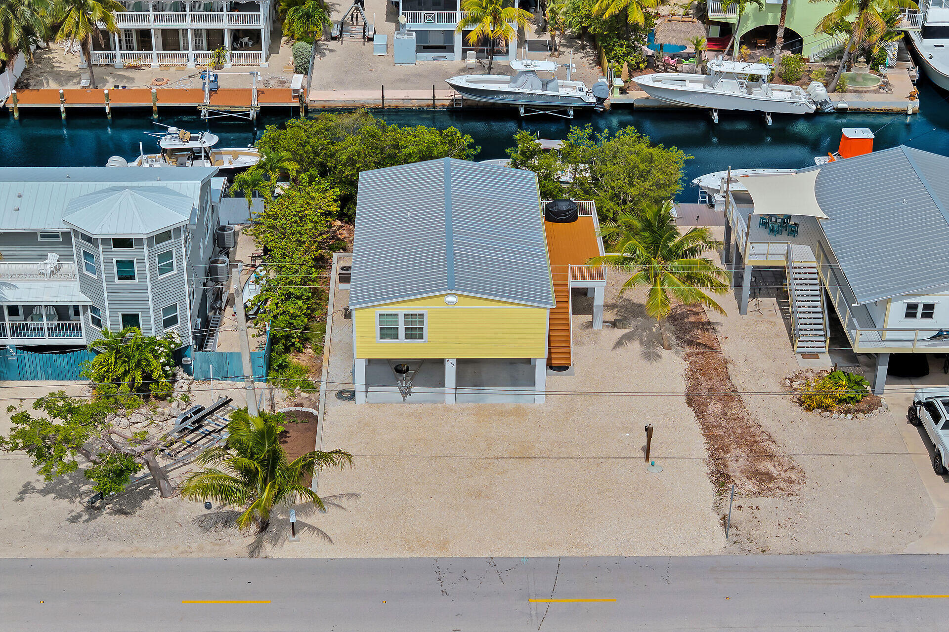 437 Pirates Road Summerland Key, FL 33042 - Photo 4 of 39 an aerial view of a swimming pool with outdoor seating