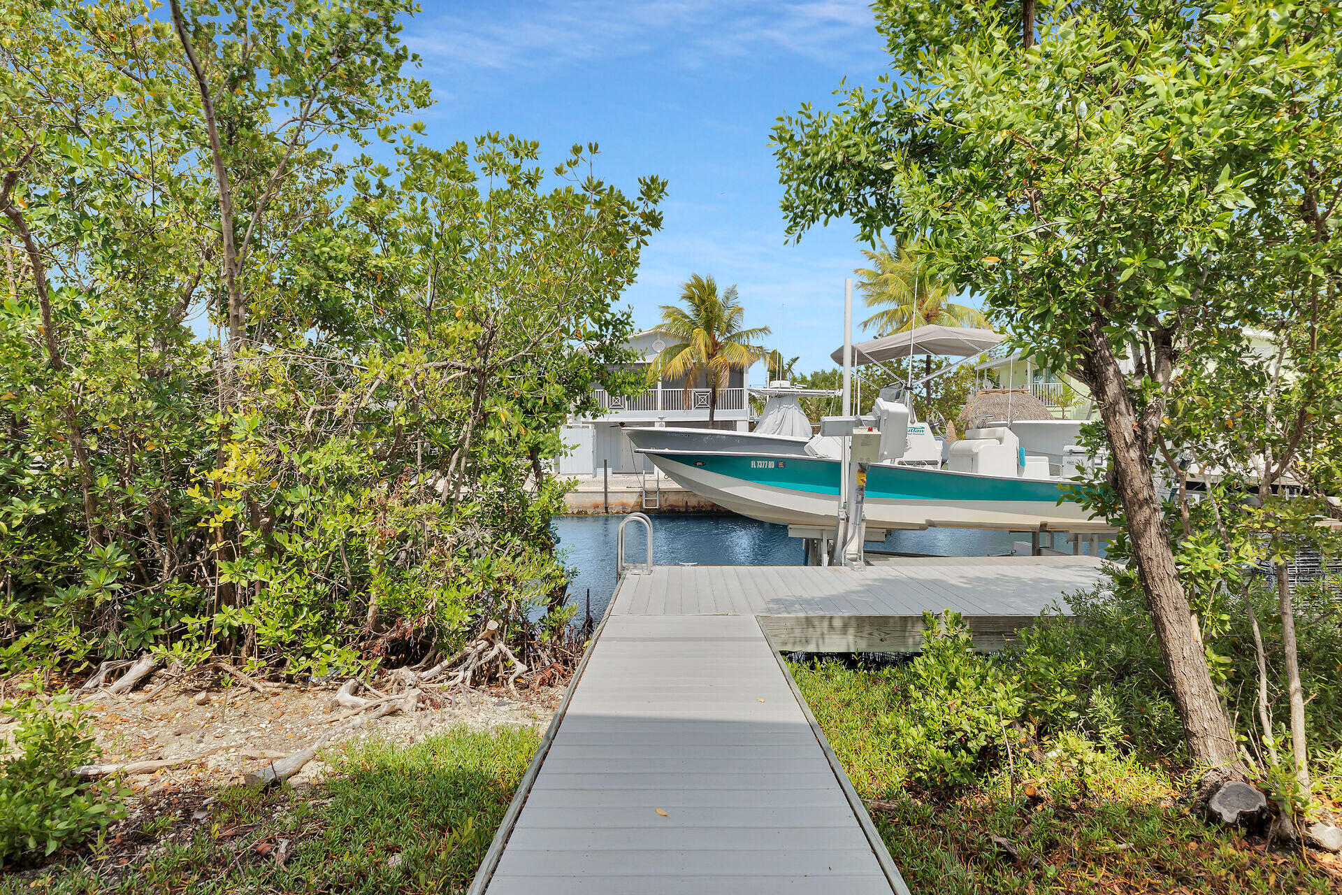 437 Pirates Road Summerland Key, FL 33042 - Photo 6 of 39 a view of balcony with wooden floor and fence