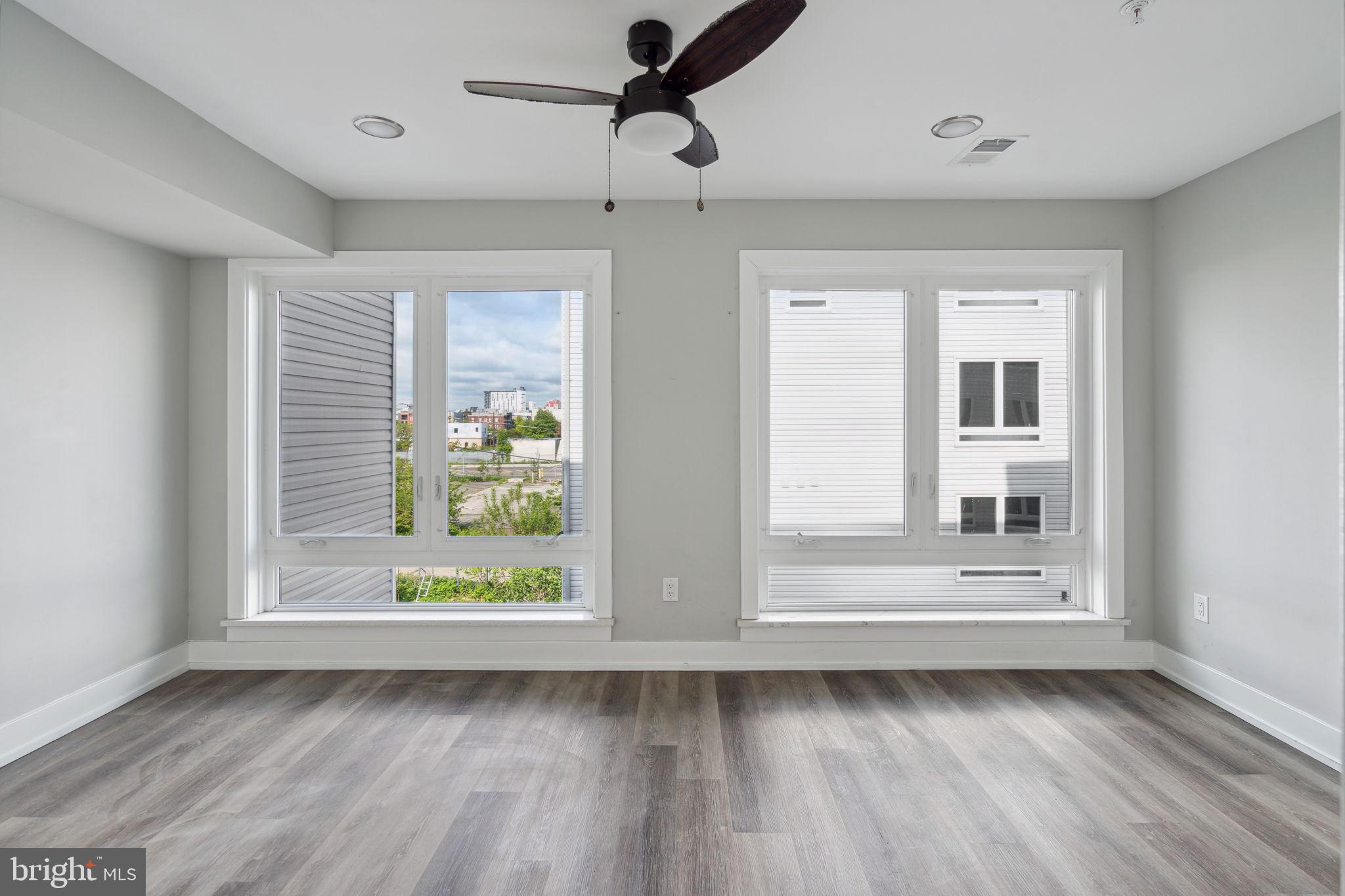 1930 North 2nd Street, Unit 2A Philadelphia, PA 19122 - Photo 12 of 23 a view of room with window and hardwood floor