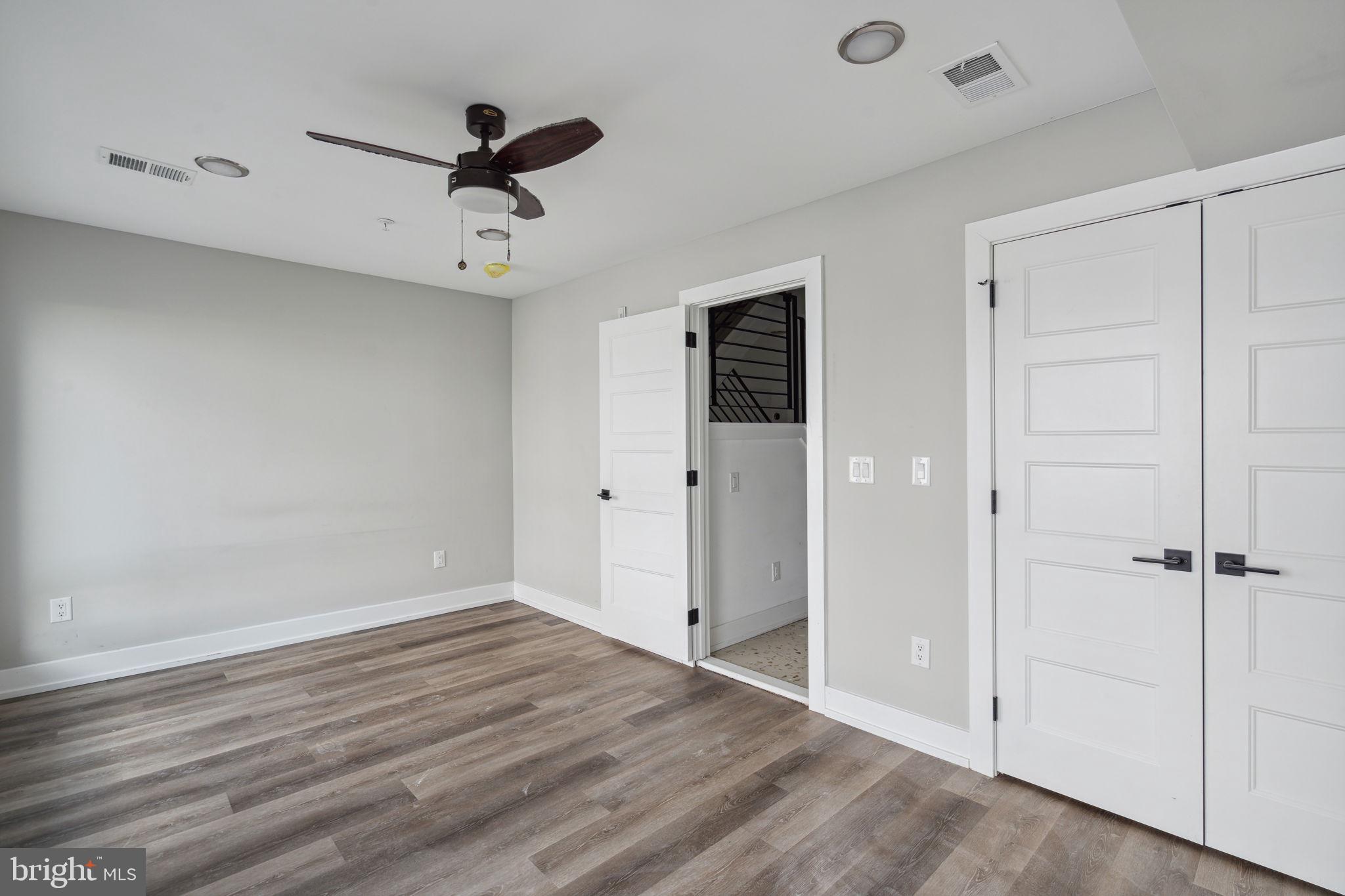 1930 North 2nd Street, Unit 2A Philadelphia, PA 19122 - Photo 13 of 23 wooden floor in an empty room with a window