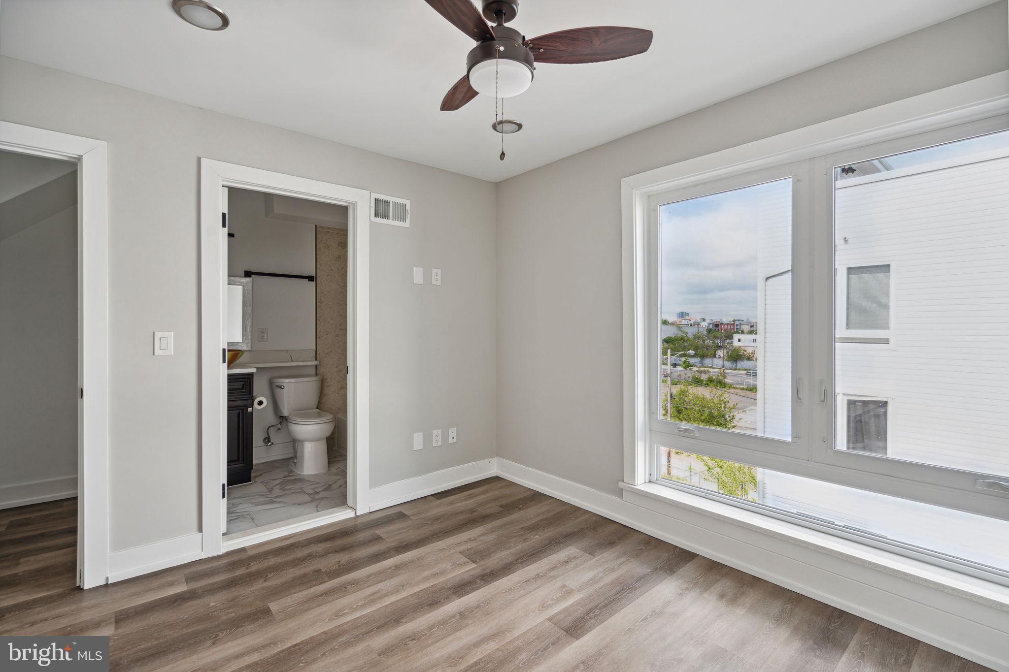 1930 North 2nd Street, Unit 2A Philadelphia, PA 19122 - Photo 18 of 23 a view of an entryway with wooden floor and a ceiling fan