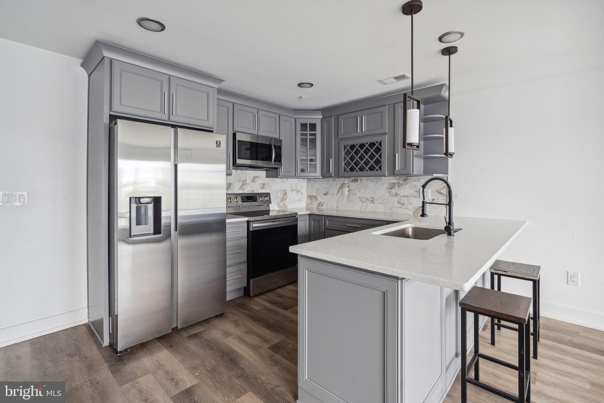 1930 North 2nd Street, Unit 2A Philadelphia, PA 19122 - Photo 2 of 23 a kitchen with a sink appliances and cabinets